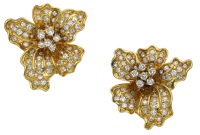 A pair of diamond en tremblant flowerhead ear clips, naturalistically modelled, the petals set with brilliant-cut...