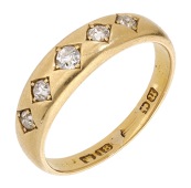A diamond five stone ring, 1894, the slightly tapered 18ct gold band inset with five graduated old brilliant-cut...