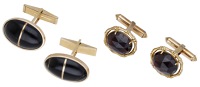Two pairs of cufflinks, the first set with rose-cut garnets in a bamboo style border, to hinged T-bar terminals,...