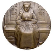 FRANCE, Le Chapelet, 1913, a uniface bronze medal by A.P. Schwab, old Breton lady seated facing on bench, edge...