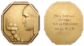 BELGIUM, Femme avec roses, c. 1935, an octagonal uniface Art Déco silver-gilt plaque by V. Demanet, female bust...