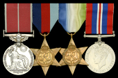 A fine Second War ‘Defensively Equipped Merchant Ships’ B.E.M. group of four awarded to Gunner V. G. Gurney,...