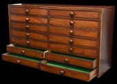 A Wooden Medal Cabinet.

A well-constructed wooden collectors medal cabinet, measuring 940mm (37 inches) long,...