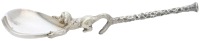 An amusing silver preserve spoon by Stuart Devlin, a monkey holding the bowl in both hands, its tail grasping the...