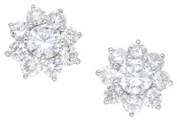 A pair of diamond cluster earrings, of flowerhead design, set throughout with brilliant-cut diamonds, total diamond...