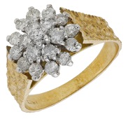 A diamond cluster ring, set with brilliant-cut diamonds to a tapered textured band, stamped ‘18CT’, total...