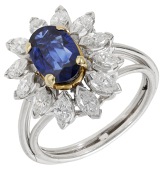 A sapphire and diamond cluster ring, set with an oval-cut sapphire within a surround of marquise-cut diamonds,...