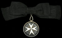The Order of St. John Serving Sister’s Badge awarded to Miss Mary F. McKenzie, for her services in South Africa...