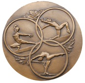 France, Gymnastics, c. 1930, a large uniface light bronze medal, unsigned, three female gymnasts performing on...