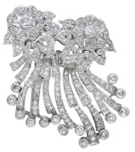 A mid 20th century diamond double clip brooch, the stylised floral sprays set with single and old brilliant-cut...