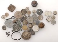 Miscellaneous lead artefacts (40), including bosses, badges, buttons, a sundial ring, two knobs/grapeshot, gaming...
