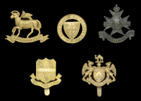 Officer Training Corps Cap Badges.
A good selection including a gilding metal High School of Glasgow O.T.C., the...