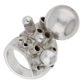 A silver ring by Graham Watling, 1971, of crossover design, the front with textured columns of various heights...