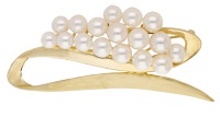A cultured pearl brooch, the polished scroll with a cluster of graduated cultured pearls, stamped ‘K18’, length...