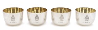 A set of four Regimental silver tumbler cups, each bearing the insignia of The Northumberland Huzzars, with gilt...