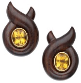 A pair of wood and citrine ear clips by Verdura, of crossover design, centred with an oval mixed-cut citrine within...