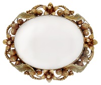 A chalcedony brooch, circa 1830, the oval vari-coloured gold frame with cannetille and foliate details, surrounding...