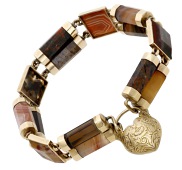 A late 19th century Scottish hardstone bracelet, designed as an alternating series of vari-coloured agate panels and...