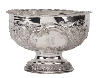 A Victorian silver small rose bowl, repoussé decorated with flowerheads and ‘C’ scrolls and having two reserves...
