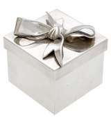 Tiffany & Co.: a silver novelty small square box and cover, the lid applied with a tied ribbon, sterling standard,...