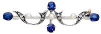 A gem-set bar brooch, circa 1900, the knifewire bar with applied scrolls set with rose-cut diamonds, with seed...
