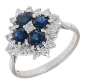 A sapphire and diamond cluster ring, set with a quatrefoil of circular-cut sapphires with brilliant-cut diamonds to...