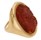 A hardstone cameo ring, possibly Italian, late 18th - early 19th century, the carnelian carved in high relief to...