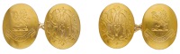 A pair of 18ct gold cufflinks, 1887, the oval plaques engraved with monogram and crest, to figure-of-eight...