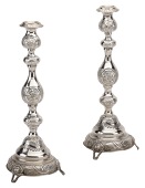 A pair of George V silver Sabbath candlesticks, in traditional style, with knopped stems and repoussé panels and...