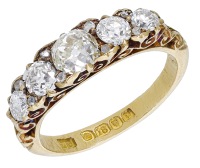 A diamond five stone ring, 1910, set with a graduated row of old brilliant and transitional-cut diamonds, to a...