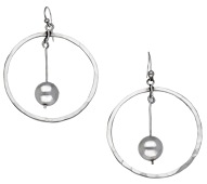 A pair of silver hoop earrings by Barbara Cartlidge, the open hoops centred with articulated polished bead drops, on...