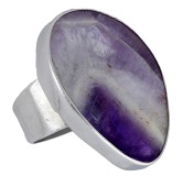 A silver fluorite ring by Barbara Cartlidge, 1970, the polished fluorite slice collet-set to a tapered band,...