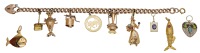 A charm bracelet, the 9ct gold curb-link chain suspending various charms to include a 9ct gold Taurus fob, a gem-set...