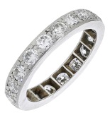 A diamond eternity ring, set throughout with old brilliant-cut diamonds, total diamond weight approximately 1.20...