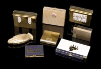 A collection of eight American ’carryall’ purses and compacts by Volupté, circa 1940-1950, 
mostly in...