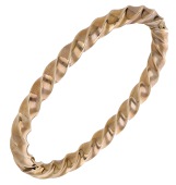 A 9ct gold bangle, of continuous twist design, UK hallmark, inner diameter 6.2cm. 	 £500-£700