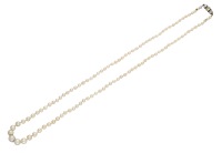 An antique natural pearl necklace, the graduating pearls, measuring approximately 3.2mm - 6.9mm, to a clasp set with...