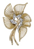 A diamond spray brooch, French, circa 1950, the stylised flower with openwork wire petals and single-cut diamonds to...