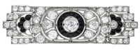 An Art Deco onyx and diamond panel brooch, the pierced rectangular panel set throughout with old brilliant and...