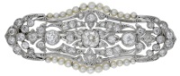 An early 20th century diamond brooch, French, the pierced cartouche set throughout with old brilliant and rose-cut...
