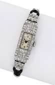 Ily. A lady’s platinum and diamond-set rectangular Art Deco cocktail watch, circa 1930.
Movement: manual winding,...
