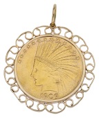 A coin pendant, the American 10 dollar coin within a scrolled 9ct gold mount, Birmingham hallmark, length including...