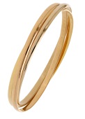An 18ct gold ‘Trinity’ bangle by Cartier, of plain polished design, signed, maker’s mark, European convention...