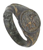 A gilt bronze seal ring, circa 1500, the round bezel with the intaglio crest of  an ‘elephant and castle’ within...