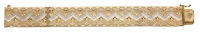 A fancy-link bracelet, of bicolour design with engraved palmette decoration, Italian assay mark, stamped ‘750’,...