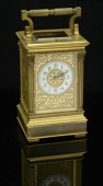 A French gilt brass carriage clock, Le Roy & Fils, with gong strike and pushbutton repeat, the porcelain chapter...