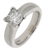 A diamond single stone ring, the princess-cut diamond, weighing 1.63 carats, claw-set to a tapered band, mounted in...