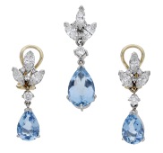 An aquamarine and diamond pendant and earring suite, each set with a pear-shaped aquamarine drop beneath a trio of...