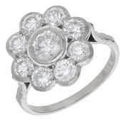 A diamond cluster ring, set throughout with brilliant-cut diamonds, stamped ‘18CT’, total diamond weight...