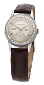 Movado. A stainless steel triple calendar wristwatch with two-tone dial, Ref. 14776, circa 1945.
Movement: cal....